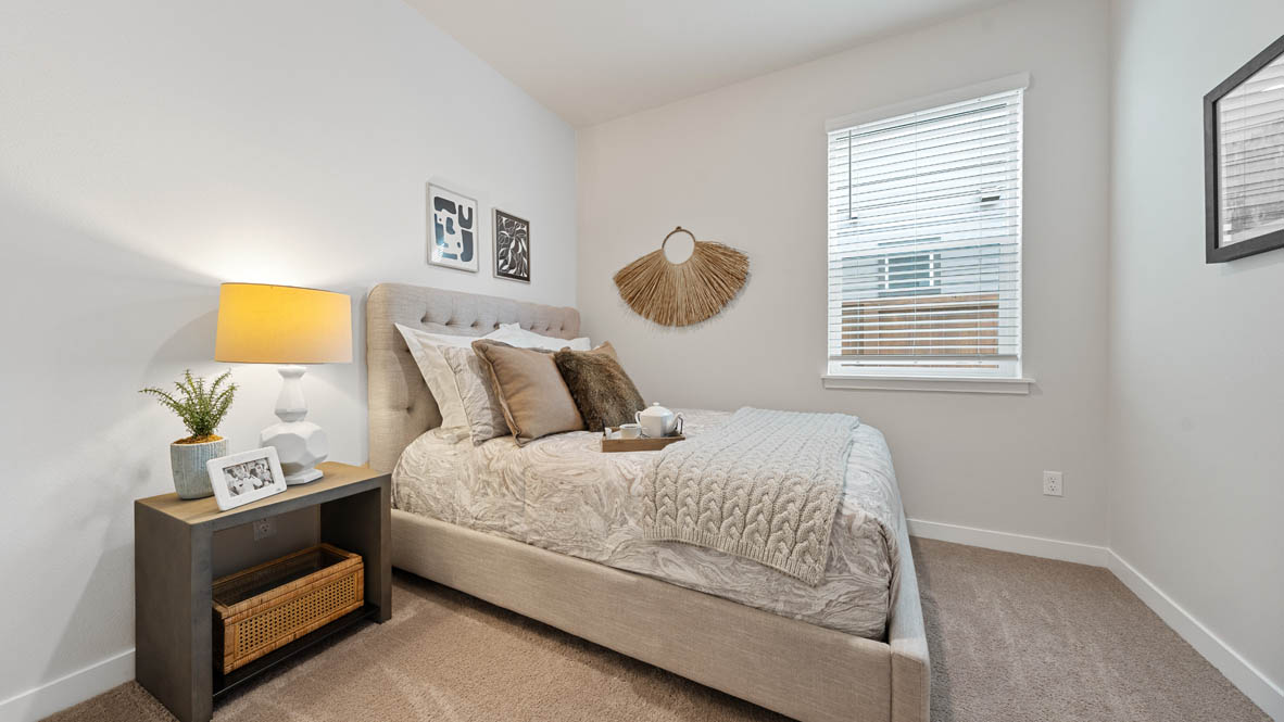 Stevens Ranch Bedroom with carpet, window, white walls, nightstand with lamp, and bed
