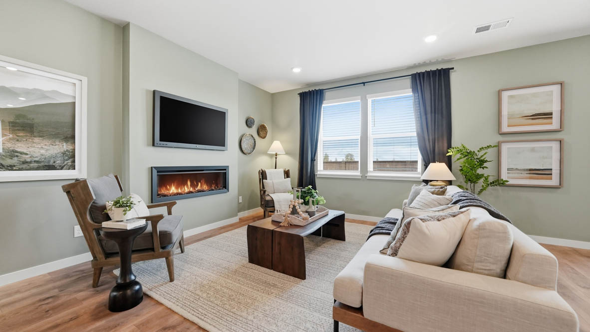 Stevens Ranch with hardwood flooring, fireplace, accent wall, l sectional couch, coffee table