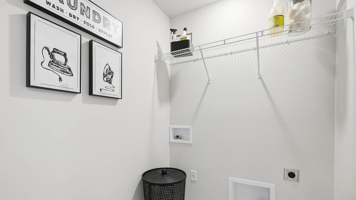 Stevens Ranch laundry room with white wire shelving for storage