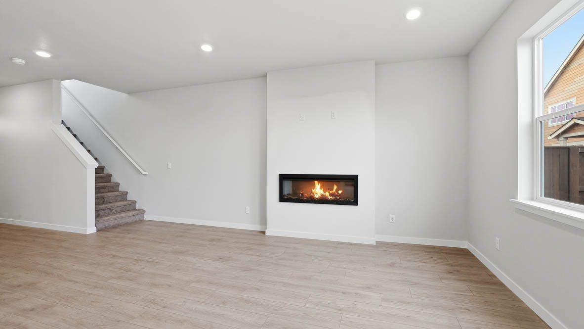 Stevens Ranch Great room with white walls, windows