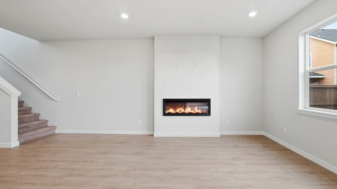 Stevens Ranch Great room with white walls, windows