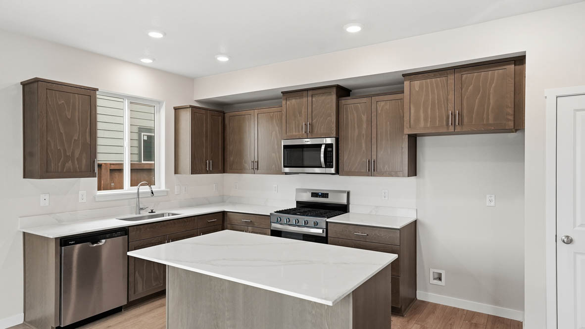 Stevens Ranch Kitchen with appliances. with white walls, windows