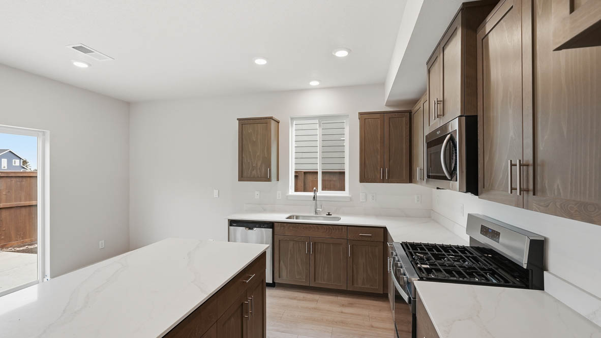 Stevens Ranch Kitchen with appliances. with white walls, windows