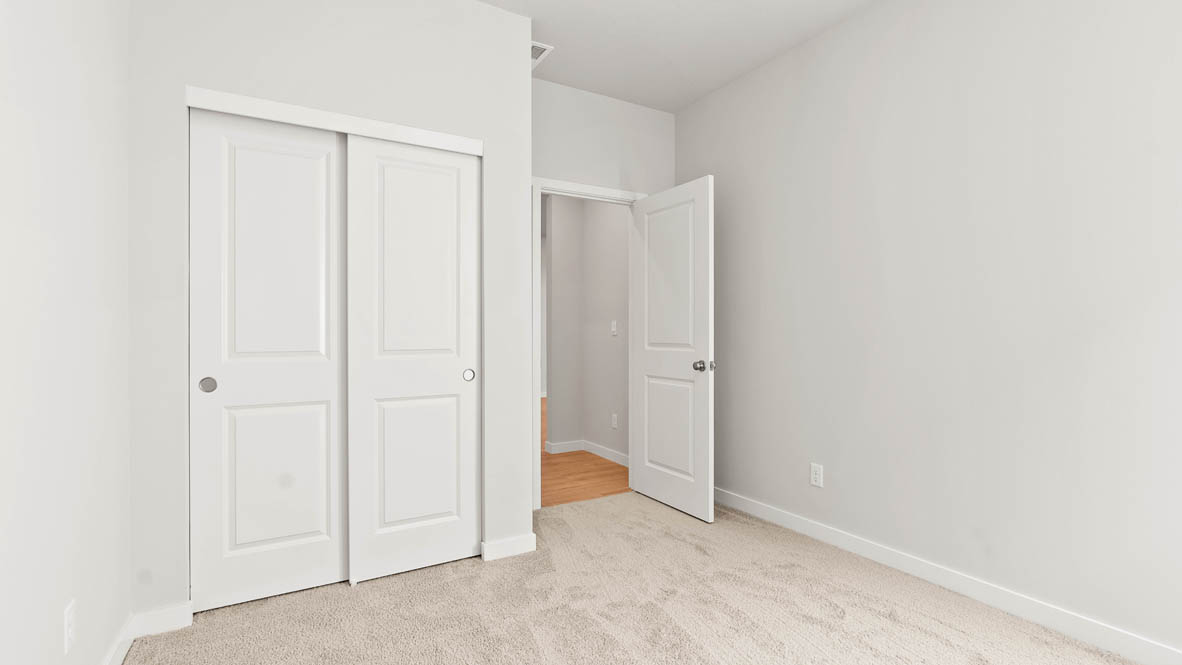 Stevens Ranch bedroom with carpet and closet
