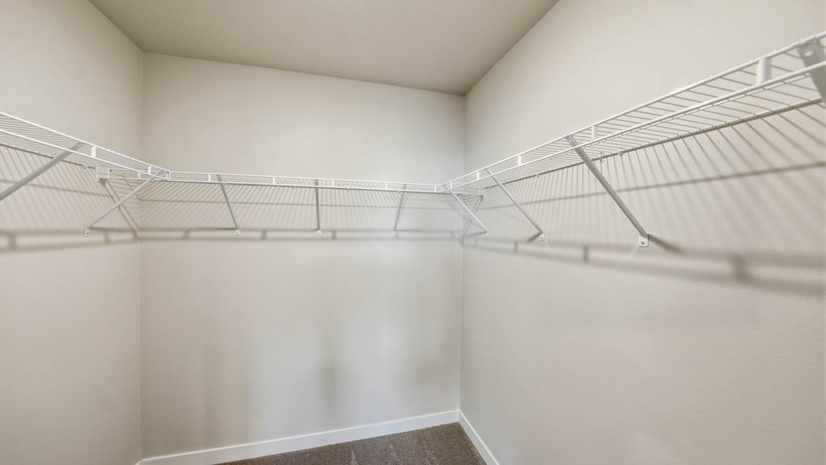 Stevens Ranch walk in closet with white wire shelving
