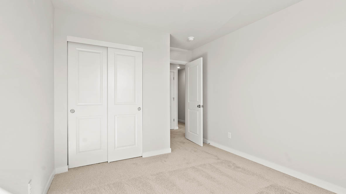 Stevens Ranch bedroom with carpet and closet