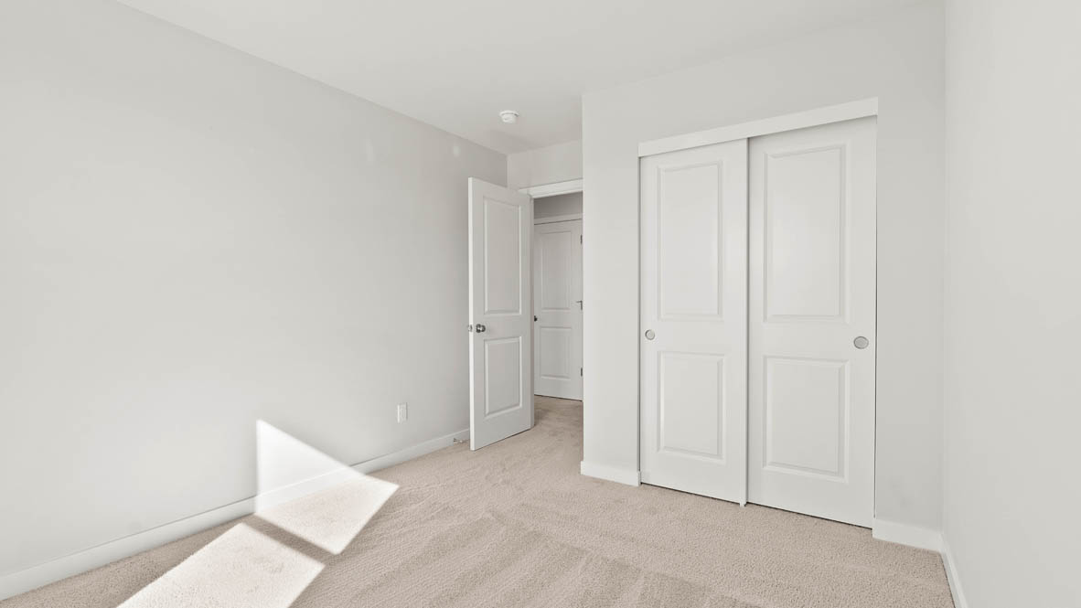Stevens Ranch bedroom with carpet and closet