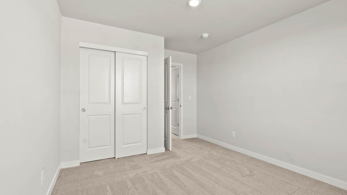 Stevens Ranch bedroom with carpet and closet