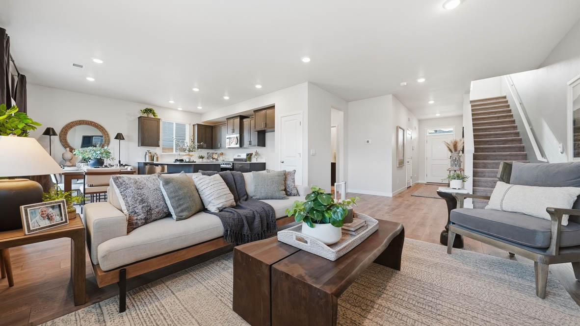 Stevens Ranch with hardwood flooring, fireplace, accent wall, l sectional couch, coffee table