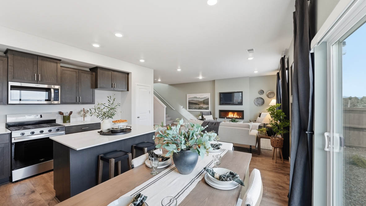 Stevens Ranch dining room with wood table, accent wall, table, decorative plant