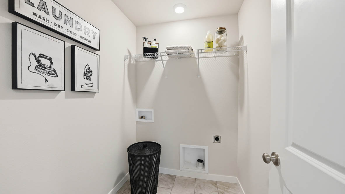 Stevens Ranch laundry room with white wire shelving