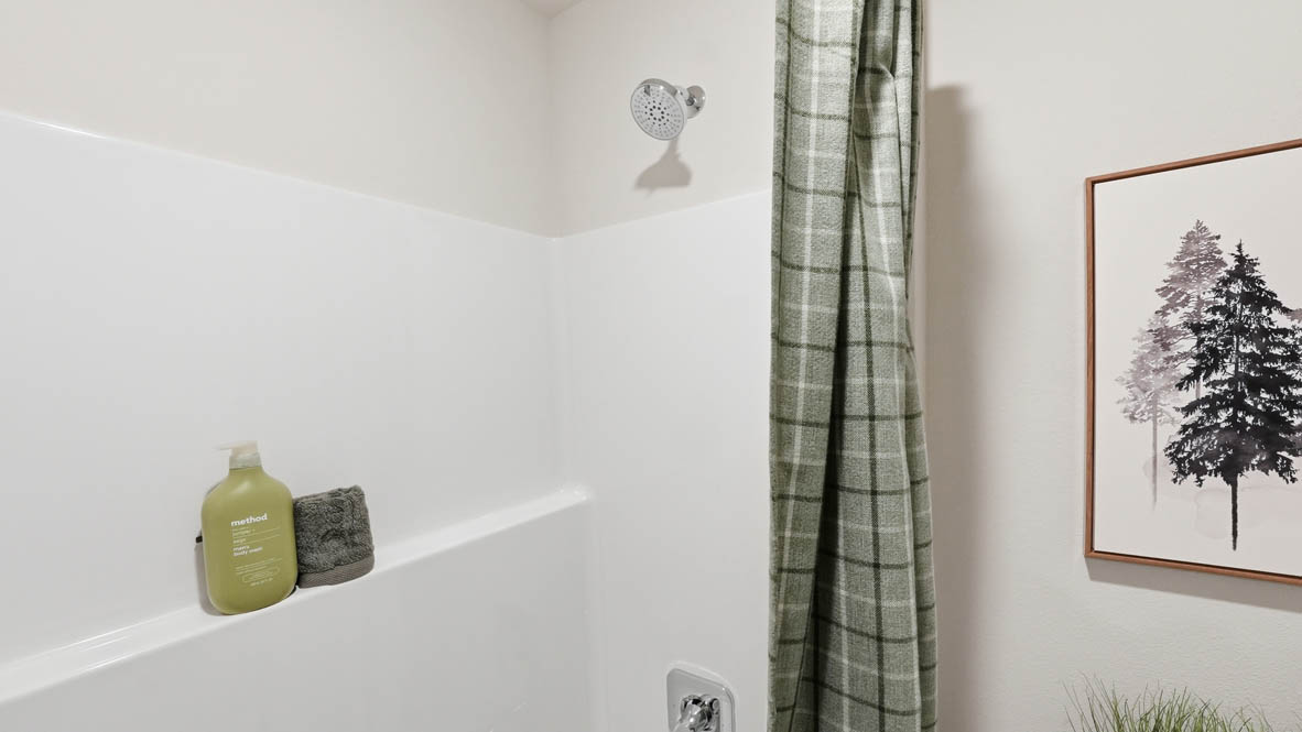 Stevens Ranch bathroom with a toilet and shower tub