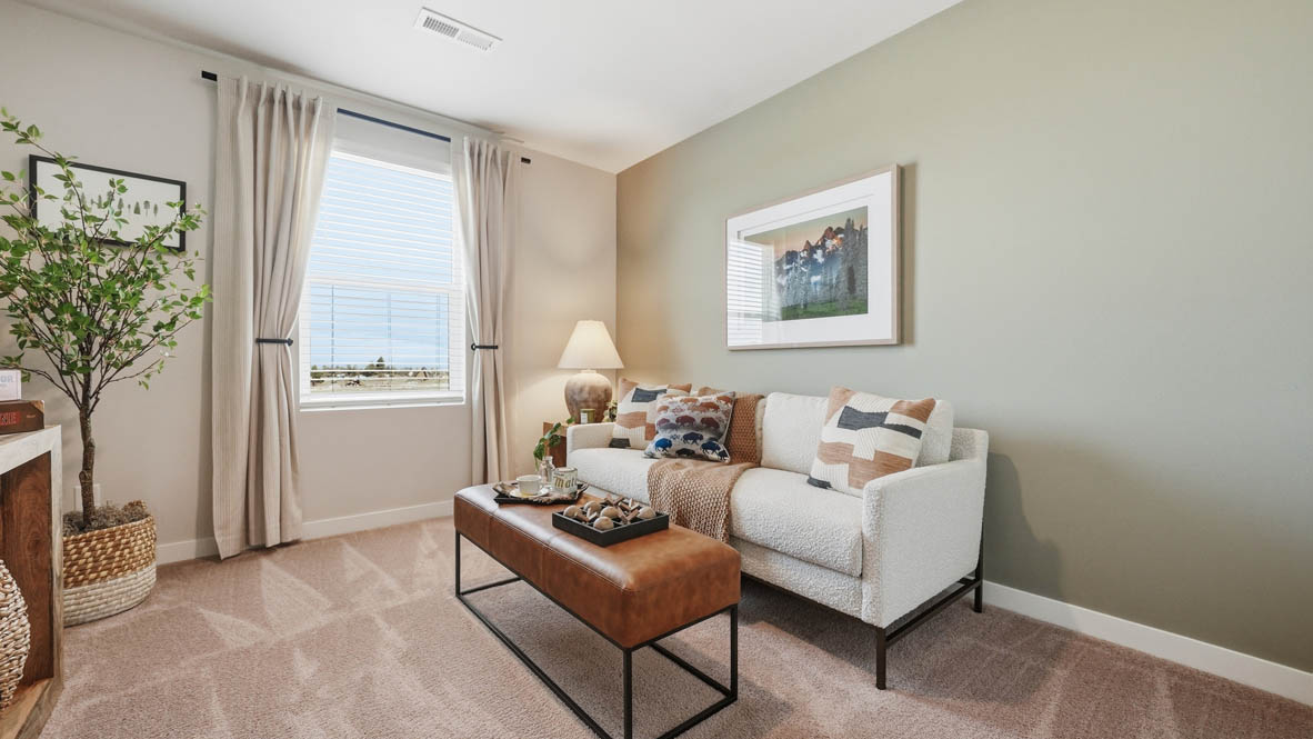 Stevens ranch bedroom as a mock tv room with a white couch, coffee table, and a window
