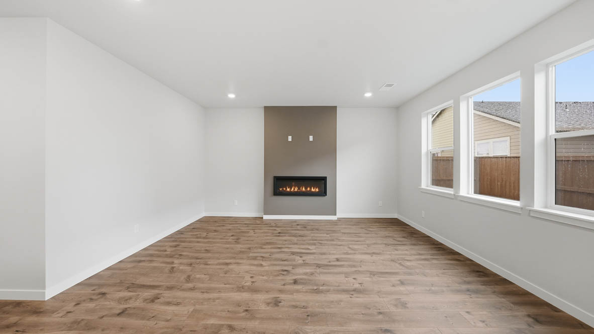 Stevens Ranch Great room with white walls, windows