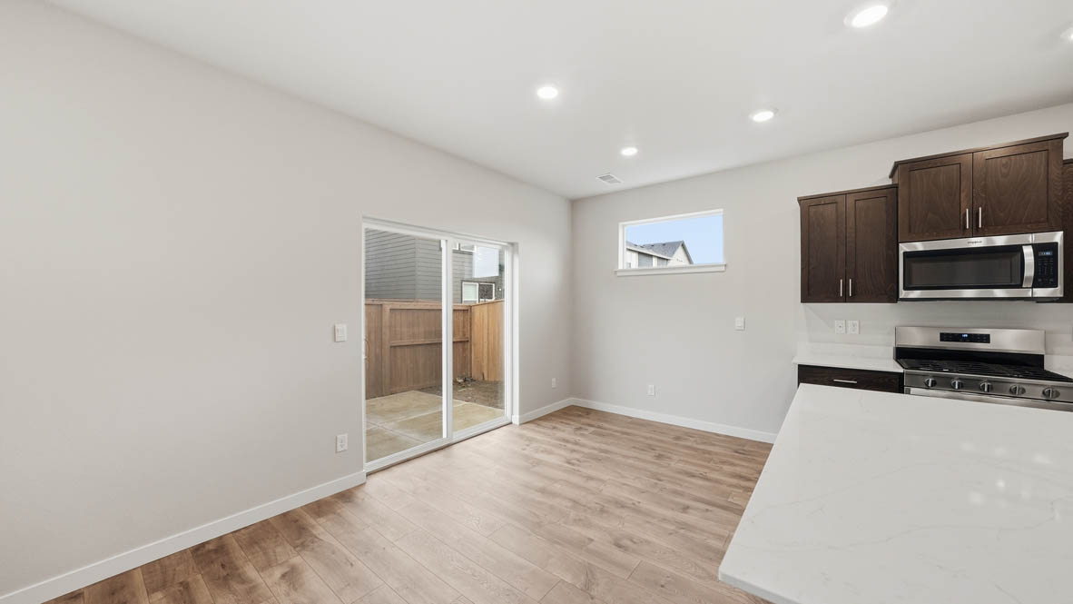 Stevens Ranch Dining with appliances. with white walls, windows