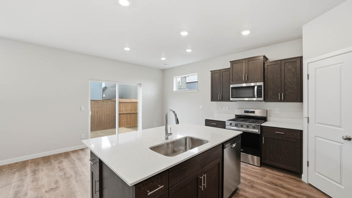 Stevens Ranch Kitchen with appliances. with white walls, windows