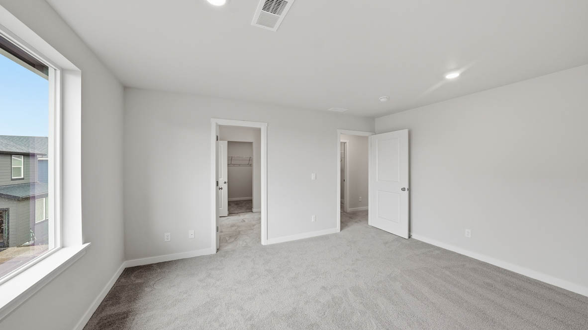 Stevens Ranch bedroom with carpet and closet