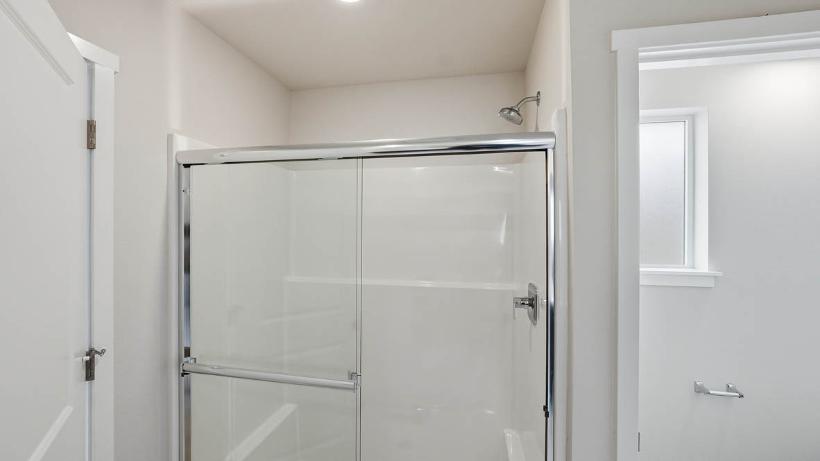 Stevens Ranch primary bathroom walk in shower with tile