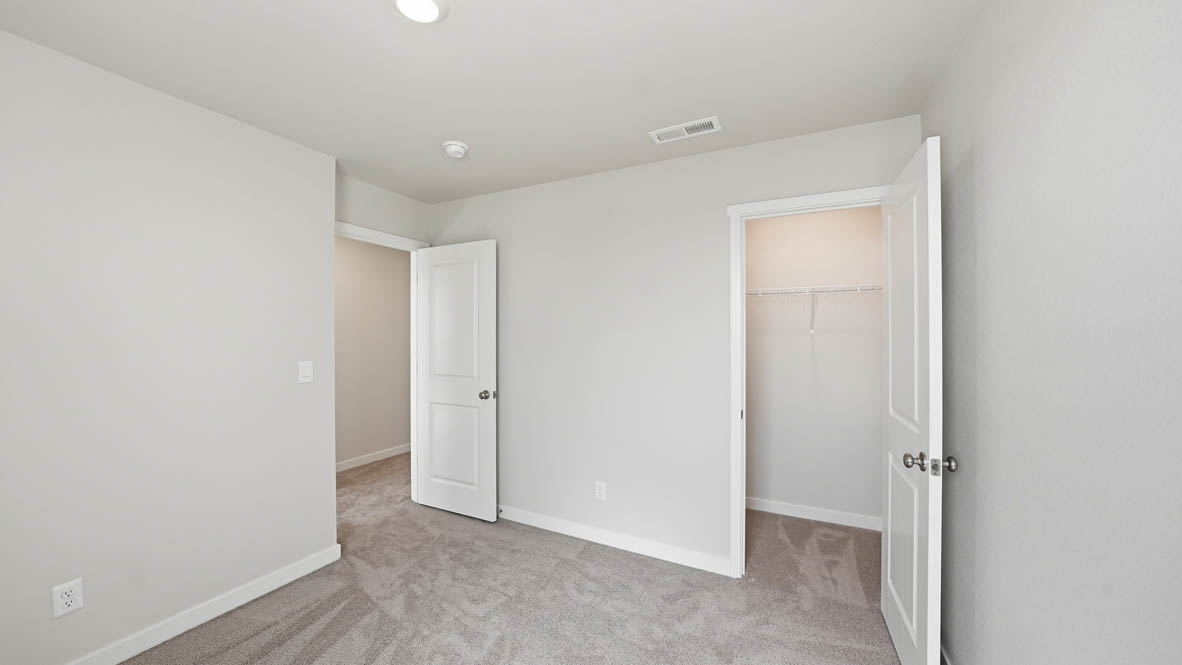 Stevens Ranch bedroom with carpet and closet