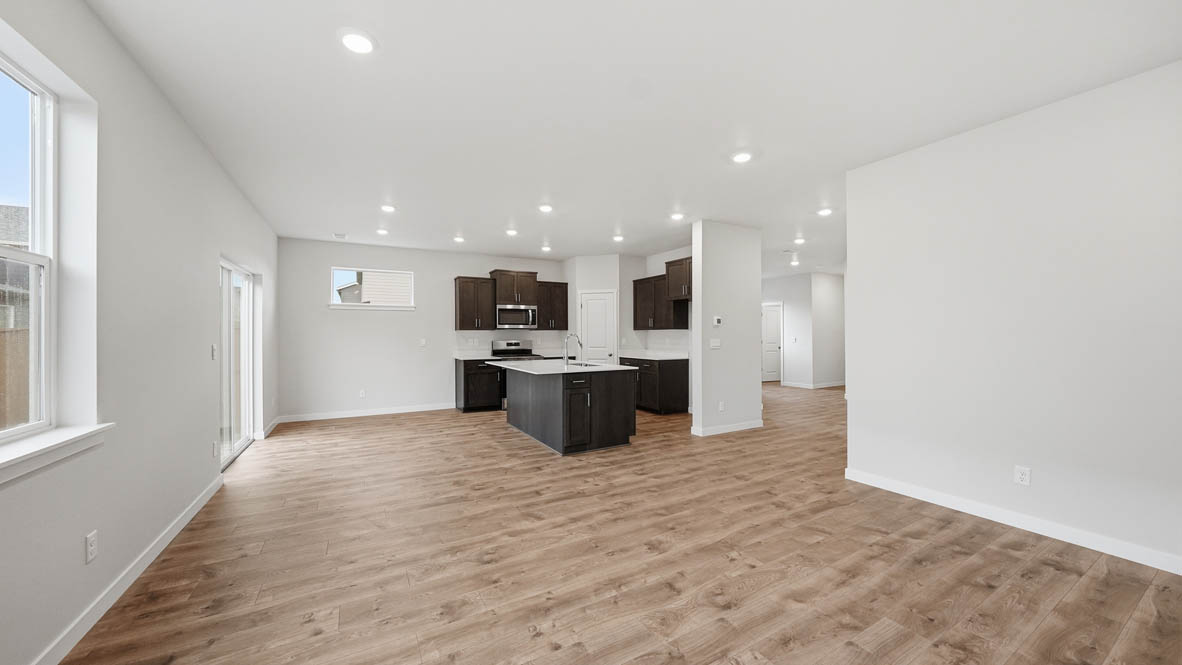 Stevens Ranch Great Room with appliances. with white walls, windows