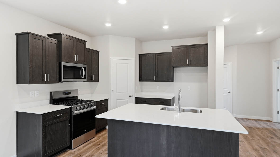 Stevens Ranch Kitchen with appliances. with white walls, windows