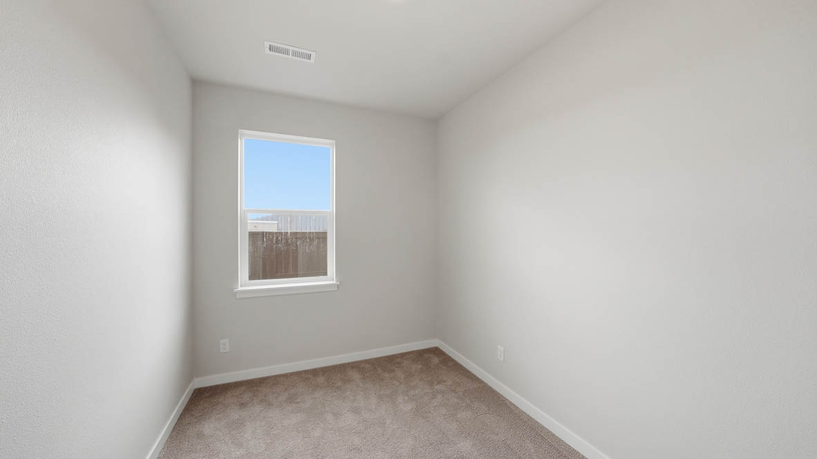 Stevens Ranch Den with carpeting and window