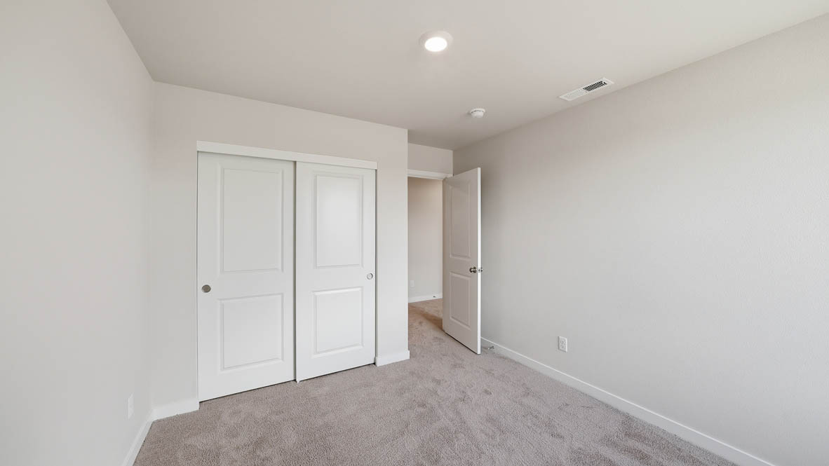 Stevens Ranch bedroom with carpet and closet