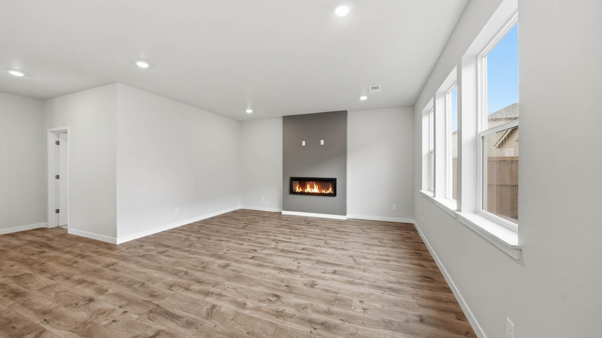 Stevens Ranch Great room with white walls, windows