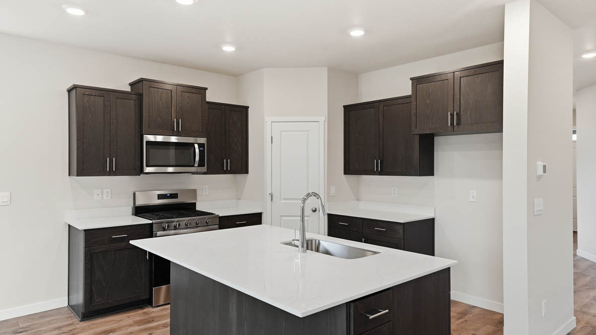 Stevens Ranch Kitchen with appliances. with white walls, windows