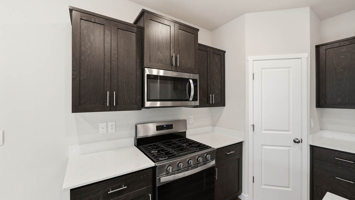 Stevens Ranch Kitchen with appliances. with white walls, windows
