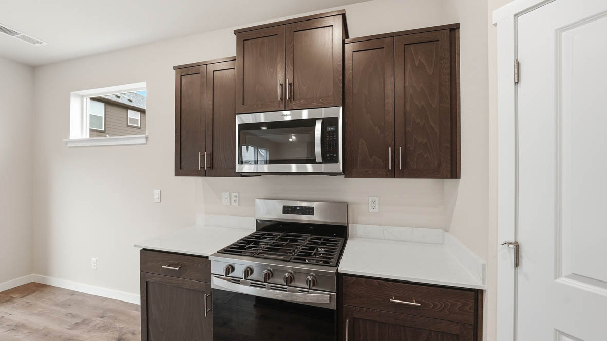 Stevens Ranch Kitchen with appliances. with white walls, windows