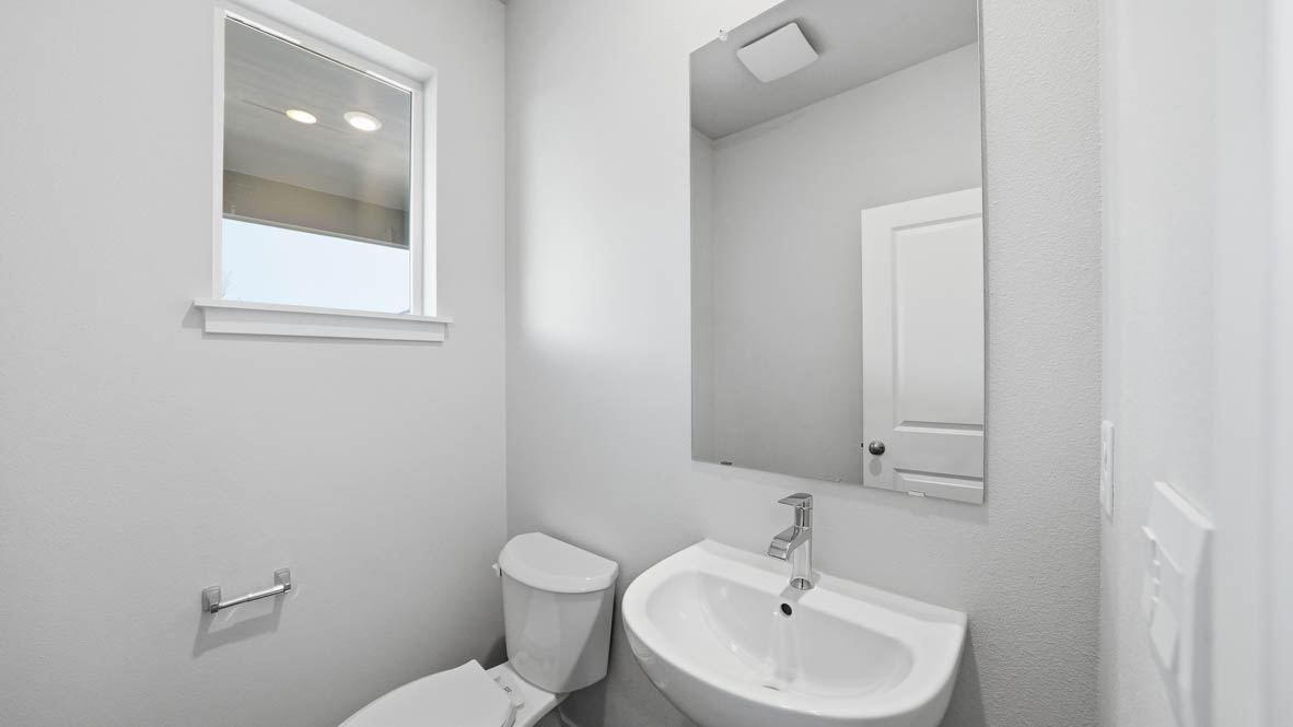 Stevens Ranch Powder Room with single sink vanity, mirror, white walls, and toilet