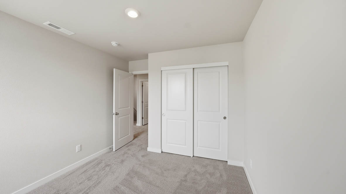 Stevens Ranch bedroom with carpet and closet