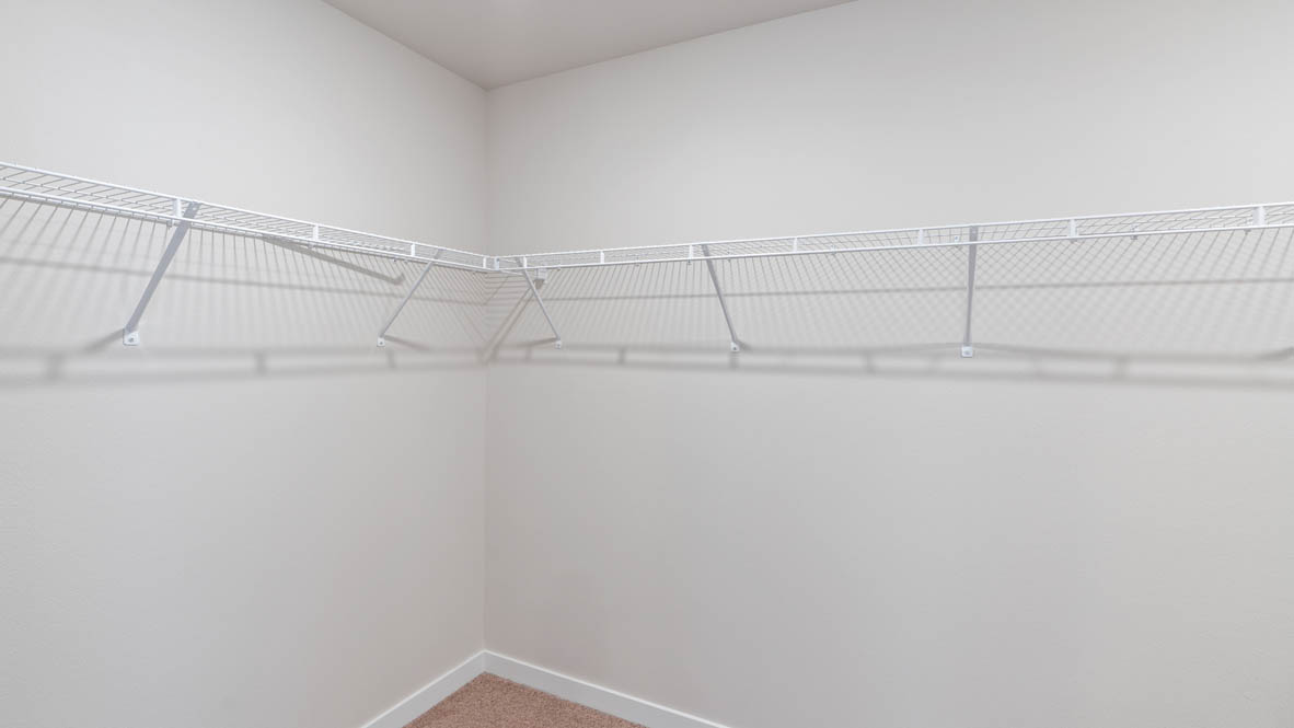 Stevens Ranch walk in closet with white wire shelving