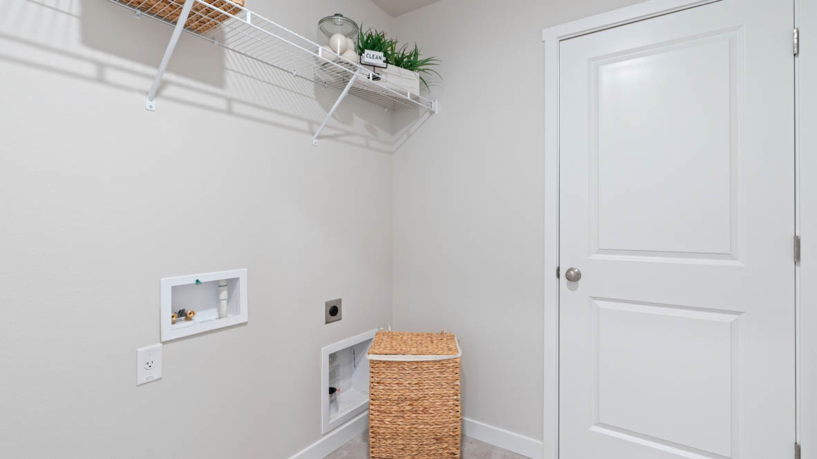 Stevens Ranch laundry room with white wire shelving