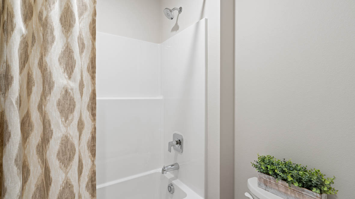 Stevens Ranch secondary bathroom with white shower tub