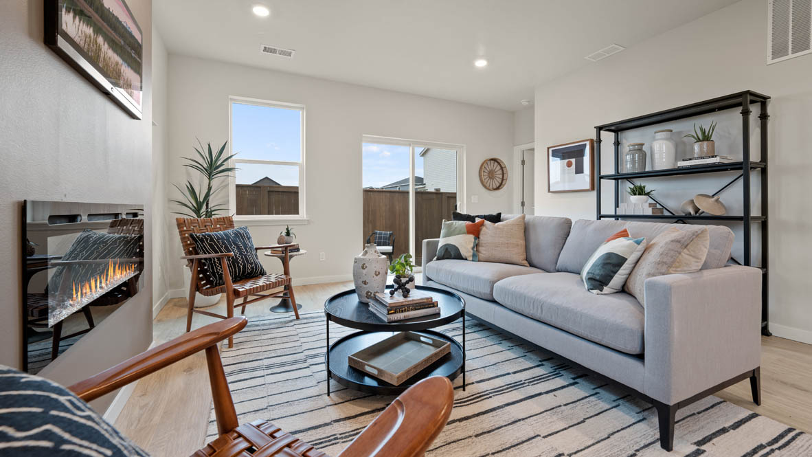 Stevens Ranch great room with white couch, rocking chair, rug, coffee table