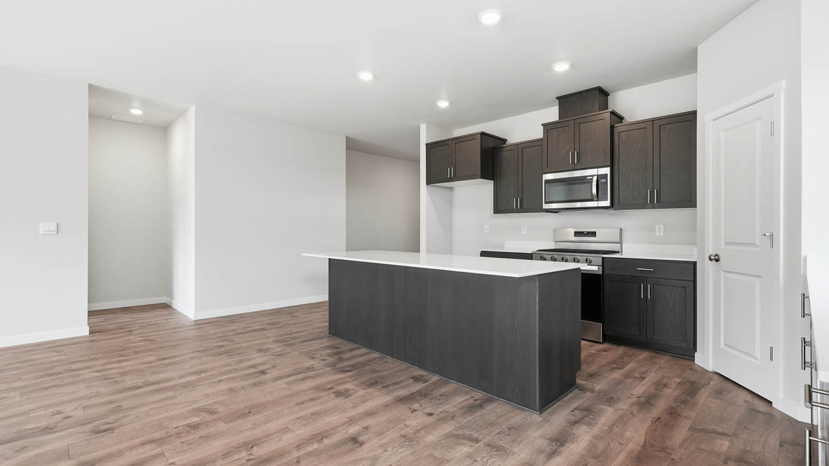 Stevens Ranch kitchen with brown stained cabinets and stainless steel appliances