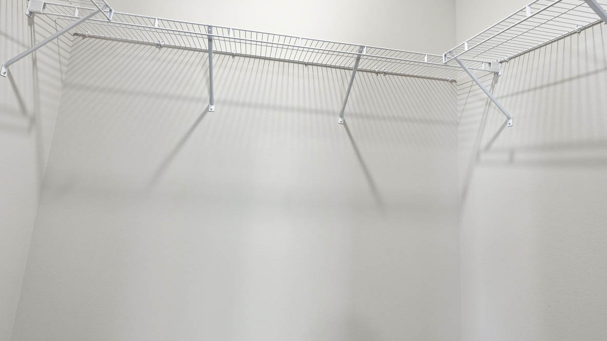 Stevens Ranch walk in closet with white wire shelving
