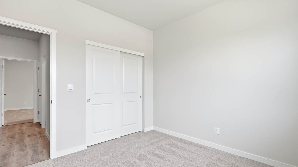 Stevens Ranch bedroom with carpet, white walls and closet