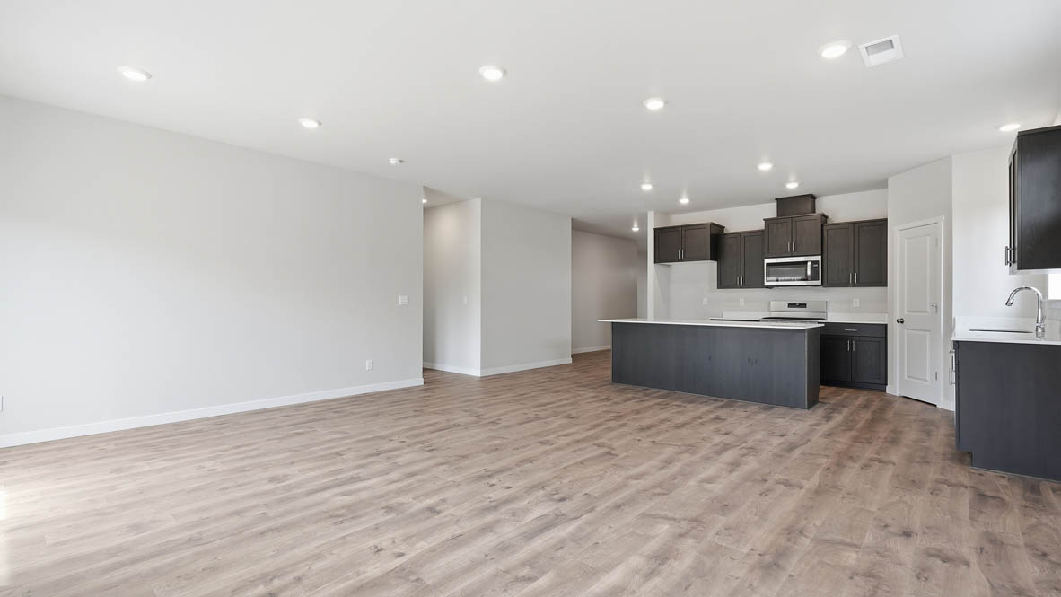 Stevens Ranch kitchen with dark stained cabinets and island