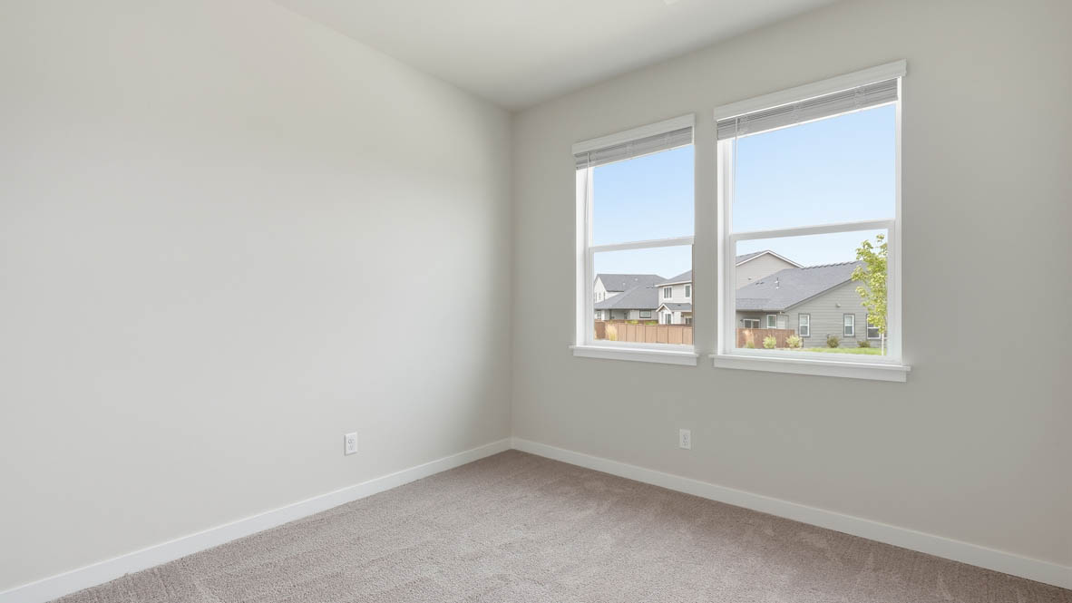Stevens Ranch bedroom with carpet, white walls, and window
