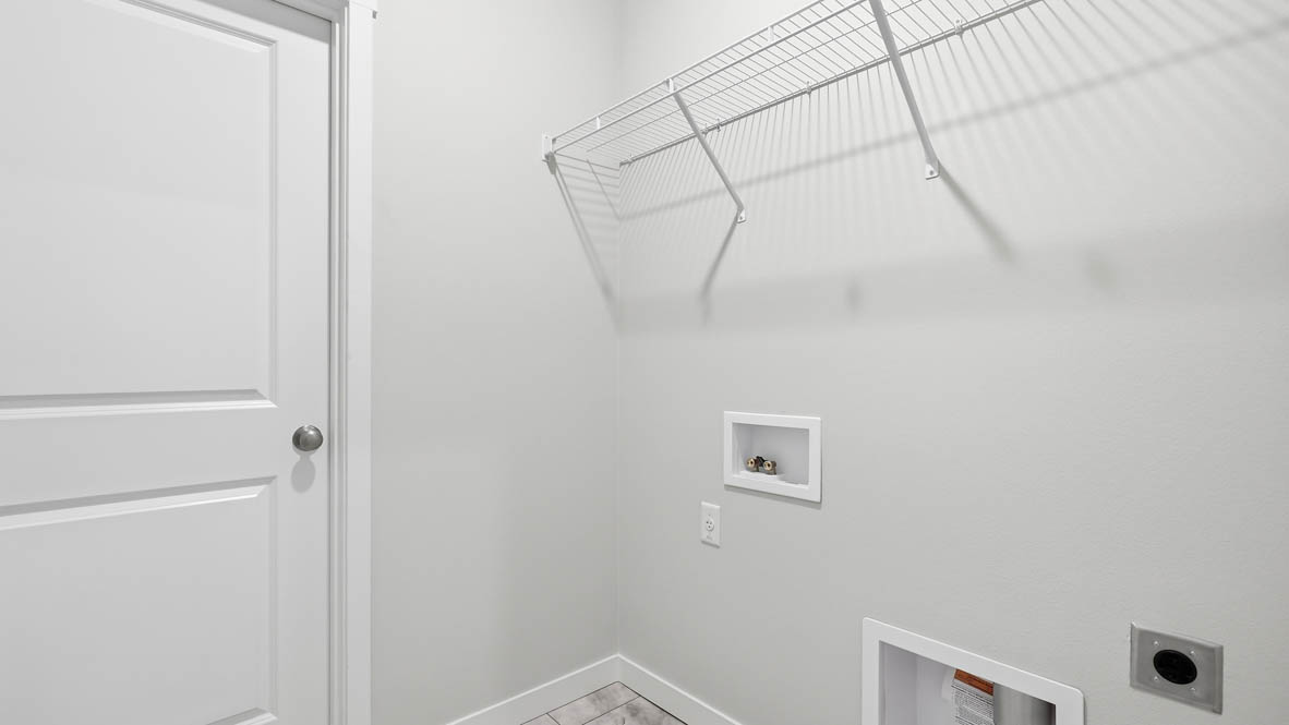 Stevens Ranch laundry room with white wire shelving