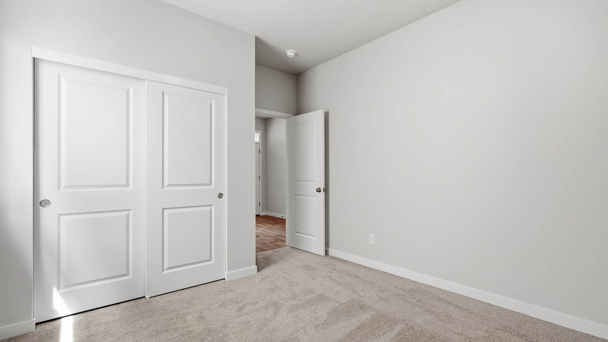 Stevens Ranch bedroom with carpet and closet