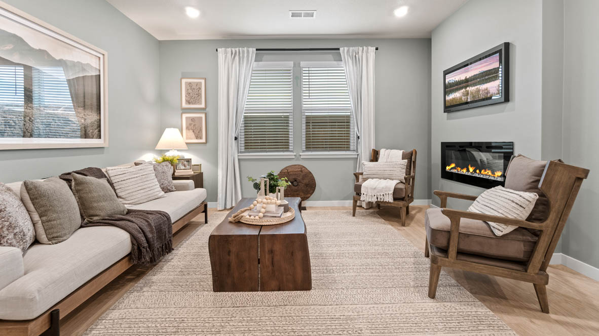 Stevens Ranch bedroom with carpet, shelving with decor, a desk with two chairs, and windows with blinds