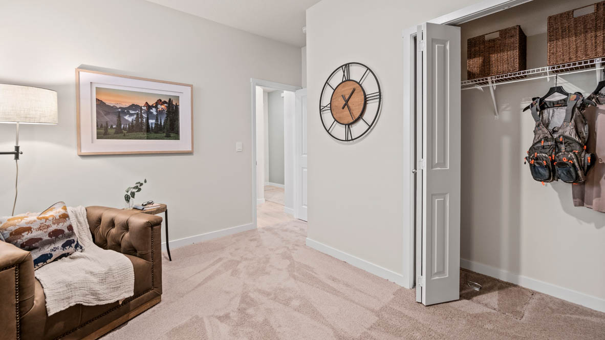 Stevens Ranch bedroom with a couch, lamp, painting, decoration clock, closet