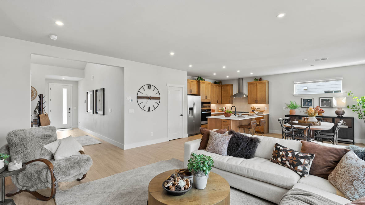 Stevens Ranch Diamond 3816 with hardwood flooring, fireplace, orange accent wall, white couches, coffee table,  two windows on the wall