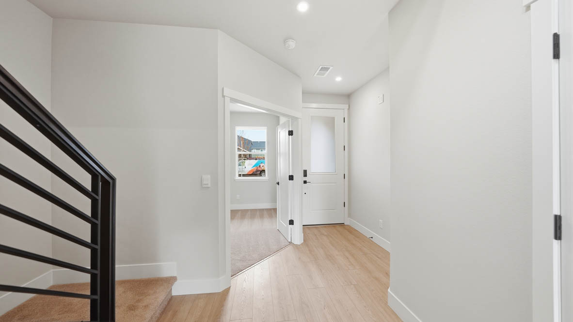 Stevens Ranch entry with laminate flooring and white walls