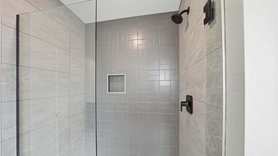 Stevens Ranch primary bathroom with walk in glass shower
