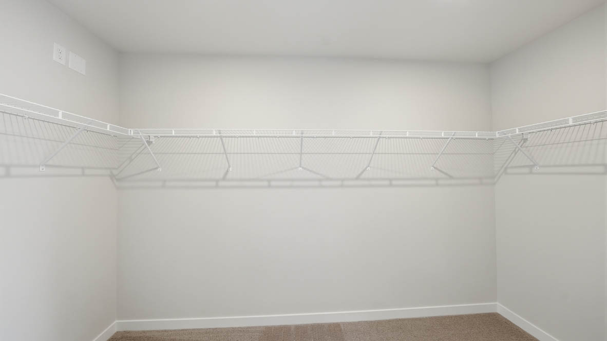 Stevens Ranch walk in closet with carpet and white wire shelving